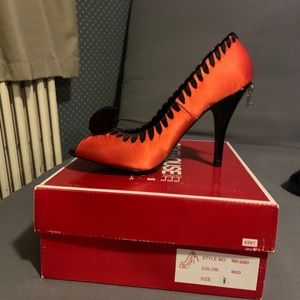 Penthouse-Red satin peep toe heel.